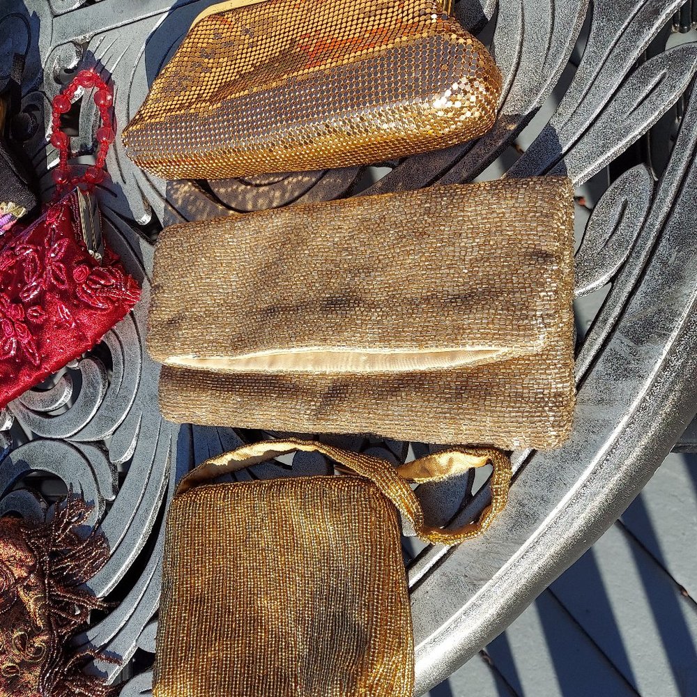 Three gold evening bags